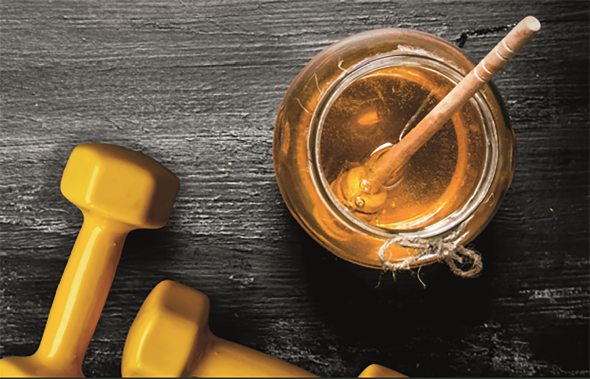 Vasetto di miele, simbolo di Honey Power come integratore per sportivi